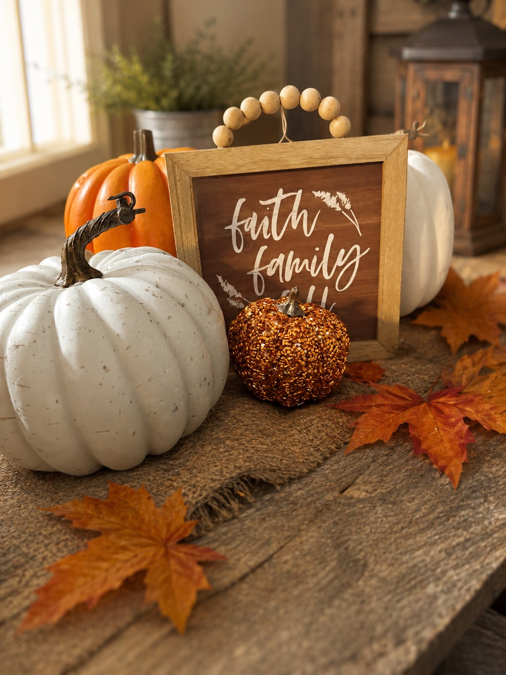 The Flip Side autumn tabletop set with a faith family fall wooden sign, white pumpkins, and a beaded copper pumpkin.