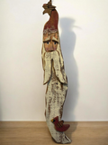 The Flip Side handcrafted wooden Santa Claus wall hanging with a distressed finish, red hat, and cardinal accent.