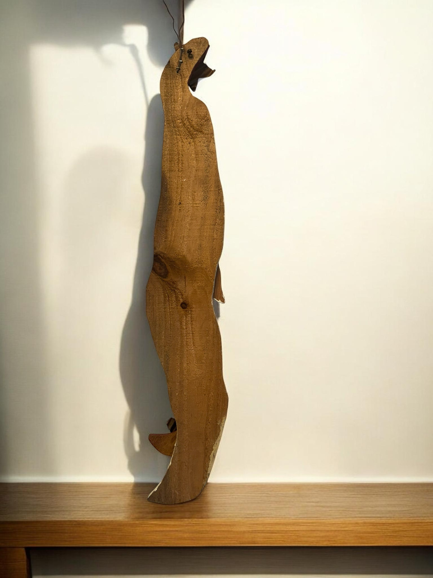 The Flip Side handcrafted wooden Santa Claus wall hanging with a rustic, weathered finish and vertical design.
